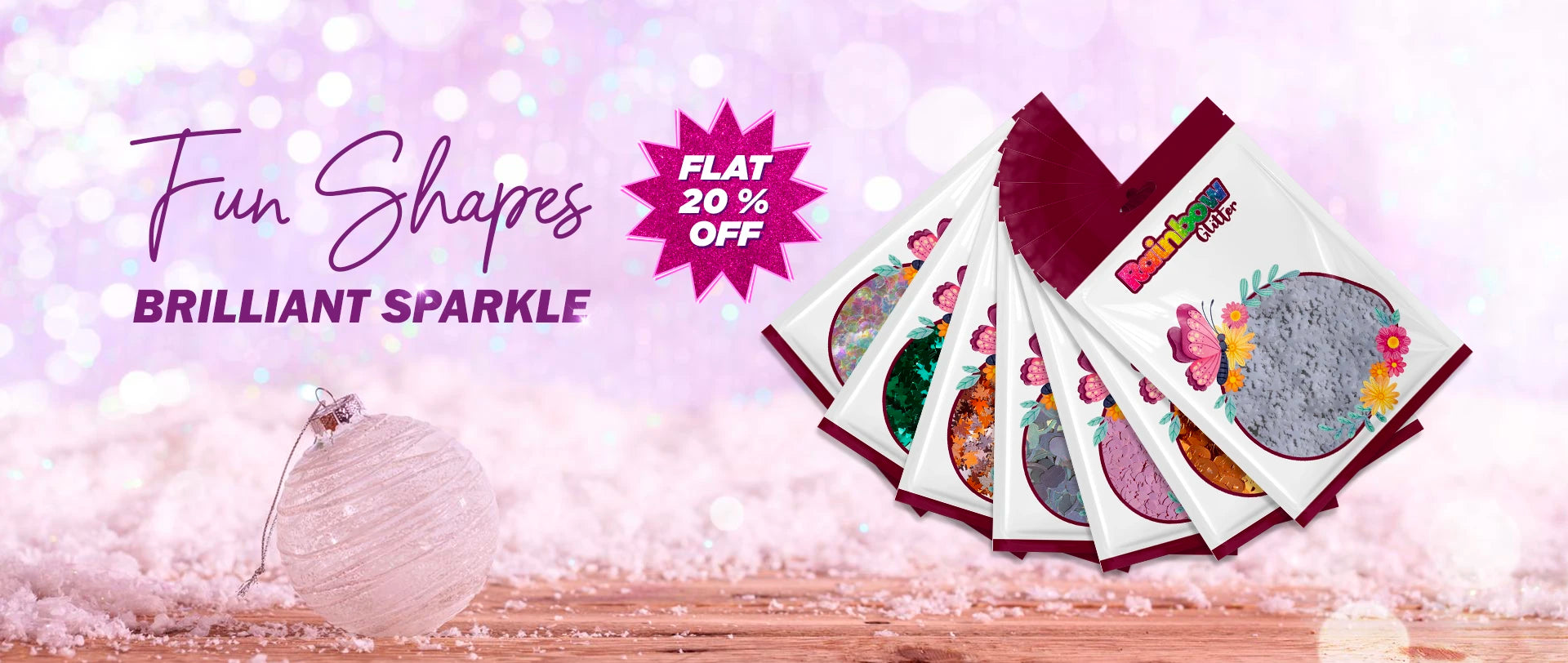 Colorful packaging with Christmas ornaments on a snowy background, featuring a discount offer.